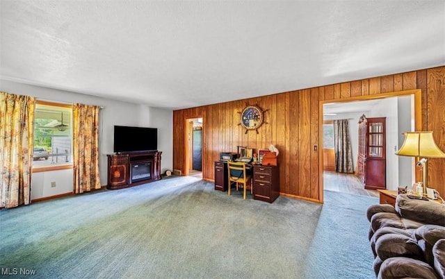1518 State Route 46 N, Jefferson, OH 44047 - carpeted living room with healthy amount of natural light, wood walls, and an office area
