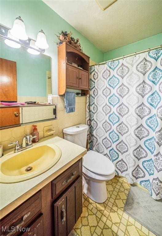 1518 State Route 46 N, Jefferson, OH 44047 - bathroom featuring vanity, tile walls, backsplash, and a shower with shower curtain