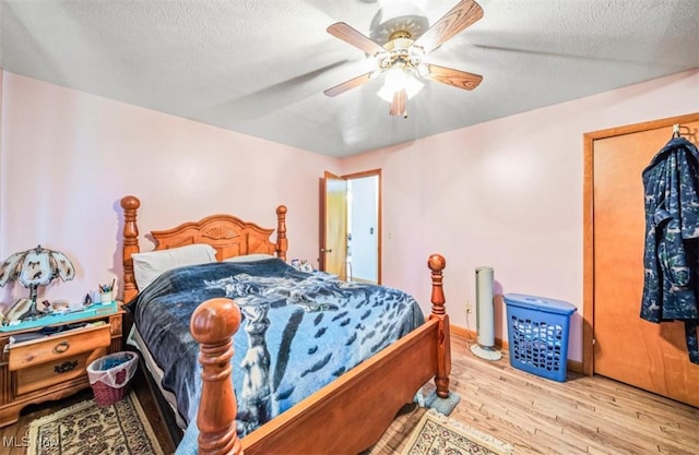 1518 State Route 46 N, Jefferson, OH 44047 - bedroom with wood finished floors, a textured ceiling, and ceiling fan