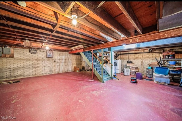 1518 State Route 46 N, Jefferson, OH 44047 - unfinished below grade area with washer / dryer, stairway, and brick wall