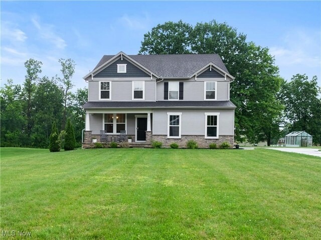 7733 Timber Ave, Hudson, OH 44236 - craftsman-style home featuring a porch, stone siding, and a front yard