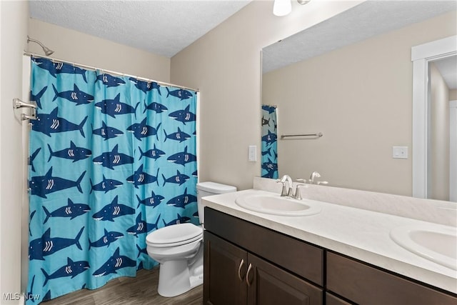 7733 Timber Ave, Hudson, OH 44236 - full bath featuring a textured ceiling, double vanity, wood finished floors, and a shower with shower curtain