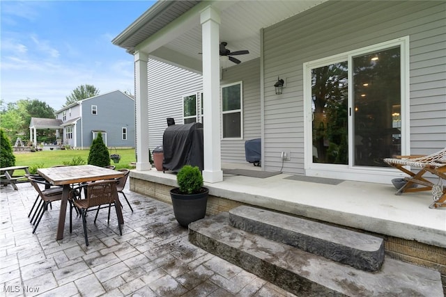 7733 Timber Ave, Hudson, OH 44236 - view of patio / terrace with outdoor dining space, a ceiling fan, and area for grilling