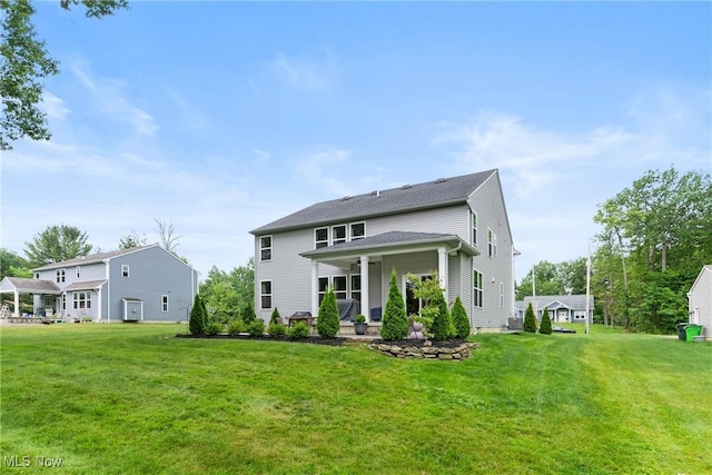 7733 Timber Ave, Hudson, OH 44236 - rear view of house with a yard and covered porch