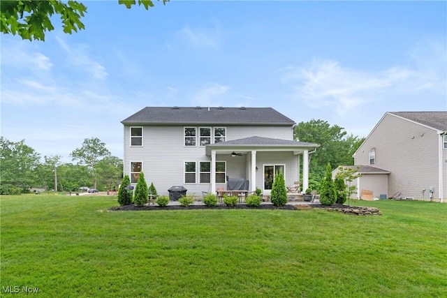 7733 Timber Ave, Hudson, OH 44236 - back of property with ceiling fan, a lawn, and a patio area
