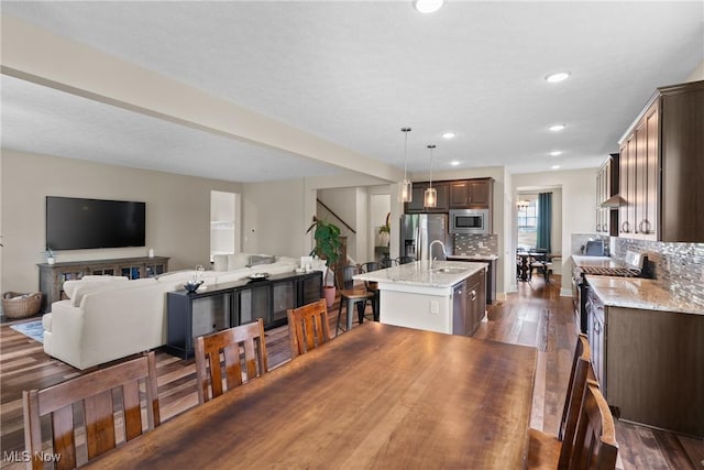 7733 Timber Ave, Hudson, OH 44236 - dining room with dark wood-type flooring, recessed lighting, and stairs