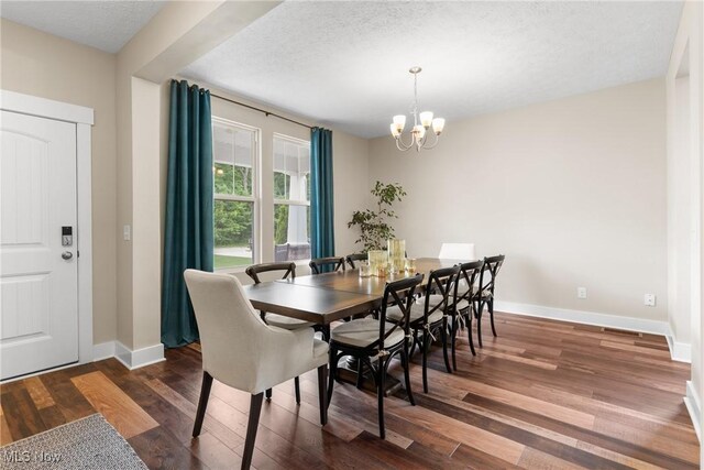 7733 Timber Ave, Hudson, OH 44236 - dining space with wood finished floors, a chandelier, and a textured ceiling