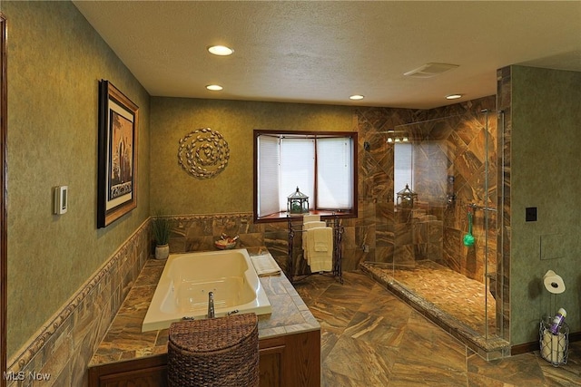2307 Deerpath Dr, Sandusky, OH 44870 - bathroom with a garden tub, a stall shower, recessed lighting, and a textured ceiling