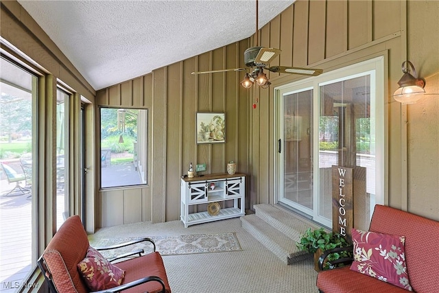 2307 Deerpath Dr, Sandusky, OH 44870 - sunroom featuring vaulted ceiling, carpet, a textured ceiling, and wood walls