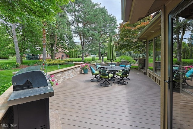 2307 Deerpath Dr, Sandusky, OH 44870 - wooden terrace featuring outdoor dining area and a grill