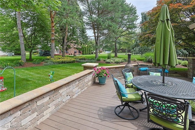2307 Deerpath Dr, Sandusky, OH 44870 - wooden terrace featuring outdoor dining area, a yard, and view of scattered trees
