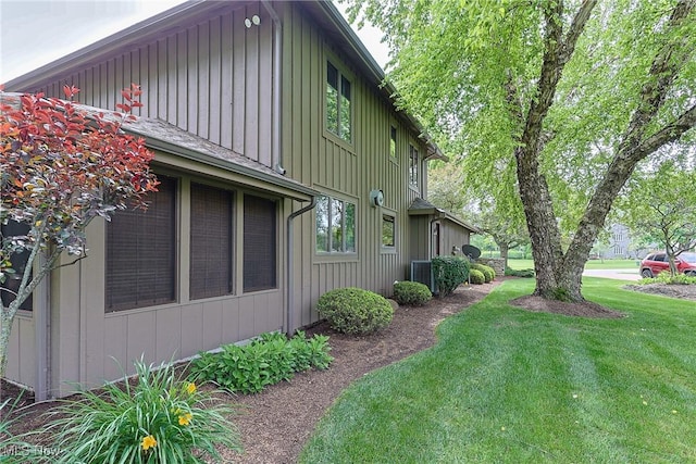 2307 Deerpath Dr, Sandusky, OH 44870 - view of property exterior with a lawn and board and batten siding