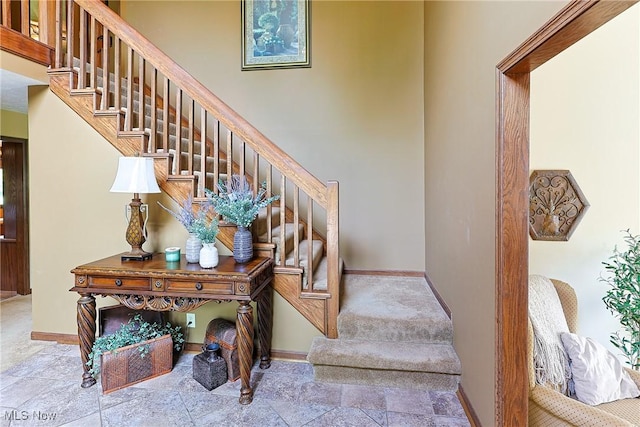 2307 Deerpath Dr, Sandusky, OH 44870 - staircase with stone finish floors and a towering ceiling