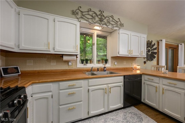 2436 Woodlawn Dr NW, Dover, OH 44622 - kitchen featuring black appliances, white cabinetry, and decorative backsplash