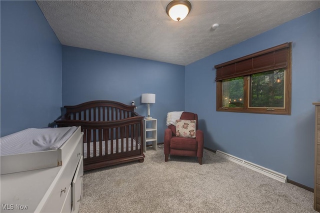 2436 Woodlawn Dr NW, Dover, OH 44622 - bedroom featuring baseboard heating, carpet, and a textured ceiling