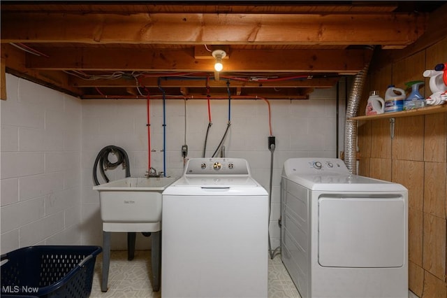 2436 Woodlawn Dr NW, Dover, OH 44622 - laundry room featuring independent washer and dryer and concrete block wall