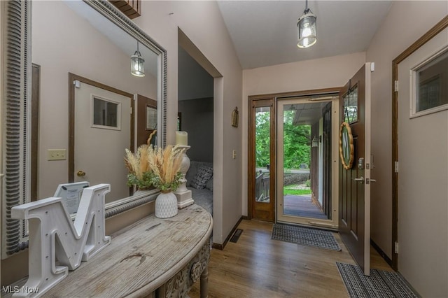 2436 Woodlawn Dr NW, Dover, OH 44622 - foyer entrance featuring wood finished floors and baseboards