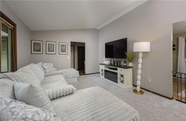 2436 Woodlawn Dr NW, Dover, OH 44622 - carpeted living room featuring vaulted ceiling and baseboards
