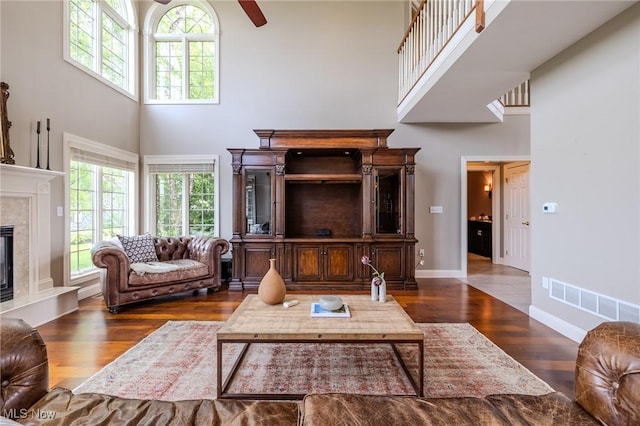 854 Crosstree Ln, Sandusky, OH 44870 - living room with a towering ceiling, wood finished floors, ceiling fan, and a high end fireplace