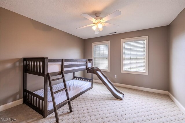 854 Crosstree Ln, Sandusky, OH 44870 - carpeted bedroom with baseboards and ceiling fan
