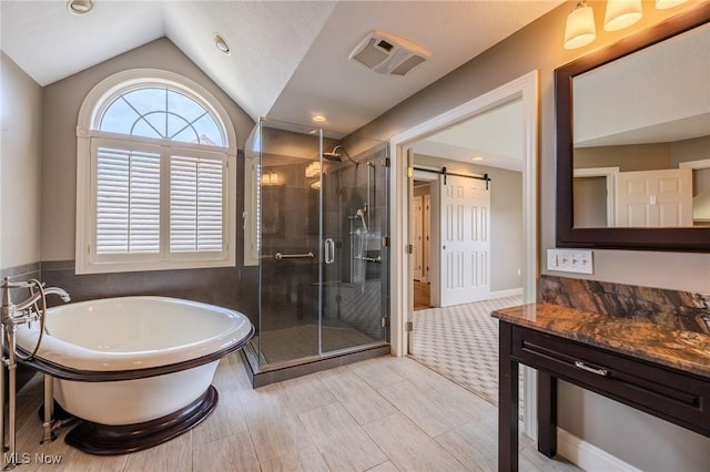 854 Crosstree Ln, Sandusky, OH 44870 - bathroom featuring a freestanding bath, vanity, a stall shower, and vaulted ceiling