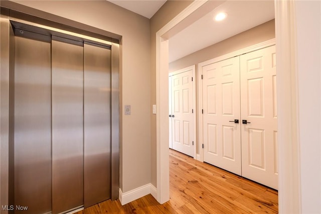854 Crosstree Ln, Sandusky, OH 44870 - hall with elevator, light wood-style flooring, and recessed lighting