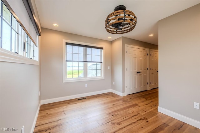 854 Crosstree Ln, Sandusky, OH 44870 - empty room featuring light wood-type flooring, a chandelier, and recessed lighting