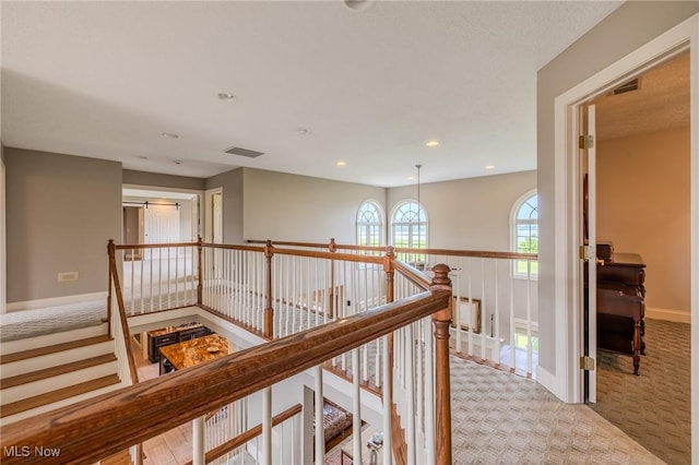 854 Crosstree Ln, Sandusky, OH 44870 - hallway featuring light colored carpet, an upstairs landing, and recessed lighting