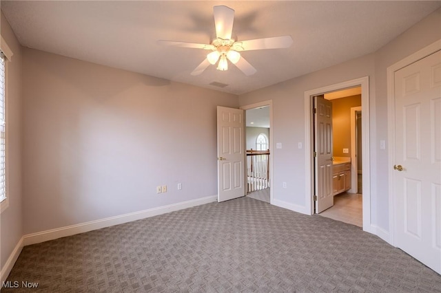 854 Crosstree Ln, Sandusky, OH 44870 - unfurnished bedroom with carpet floors, ensuite bathroom, and multiple windows