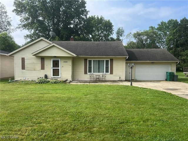 3290 NW Sweitzer St NW, Uniontown, OH 44685 - single story home with a garage, concrete driveway, a front lawn, and a shingled roof