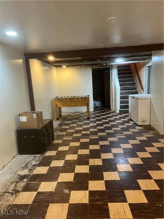 3290 NW Sweitzer St NW, Uniontown, OH 44685 - finished basement featuring stairs and tile patterned floors