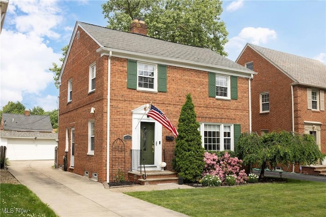 3678 Lynnfield Rd, Shaker Heights, OH 44122 - colonial inspired home featuring brick siding, a chimney, and a front lawn