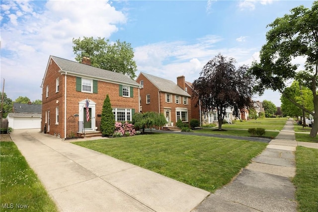 3678 Lynnfield Rd, Shaker Heights, OH 44122 - view of front of home with a front lawn, brick siding, and a chimney