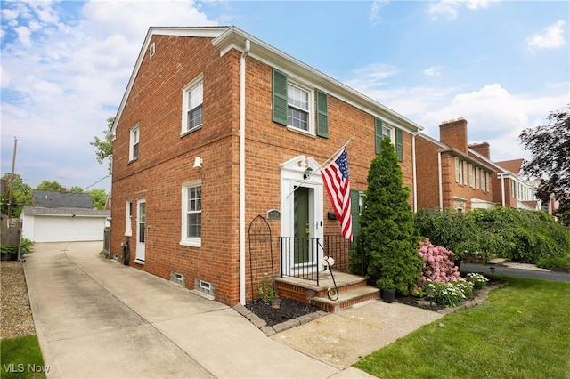 3678 Lynnfield Rd, Shaker Heights, OH 44122 - view of front facade featuring brick siding, a detached garage, and an outdoor structure