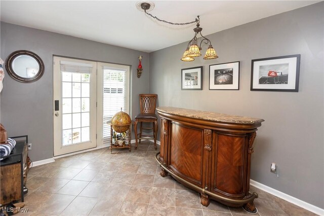 3678 Lynnfield Rd, Shaker Heights, OH 44122 - indoor dry bar with baseboards and hanging light fixtures