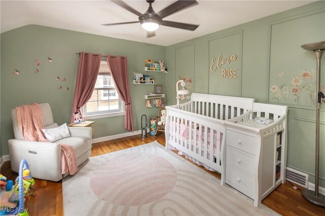 3678 Lynnfield Rd, Shaker Heights, OH 44122 - bedroom with wood finished floors, a crib, and ceiling fan