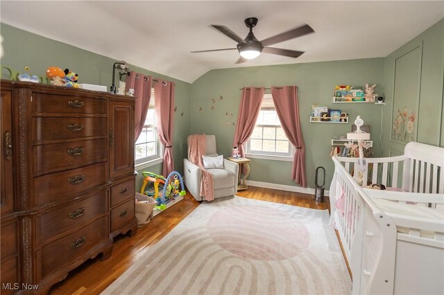 3678 Lynnfield Rd, Shaker Heights, OH 44122 - bedroom with vaulted ceiling, light wood-style flooring, a crib, and a ceiling fan