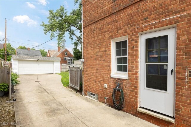 3678 Lynnfield Rd, Shaker Heights, OH 44122 - view of side of property with brick siding, a garage, and an outdoor structure