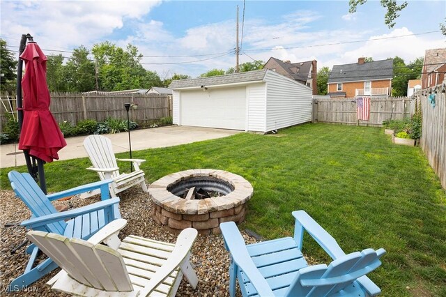 3678 Lynnfield Rd, Shaker Heights, OH 44122 - fenced backyard with a fire pit, an outdoor structure, a garage, and a patio area