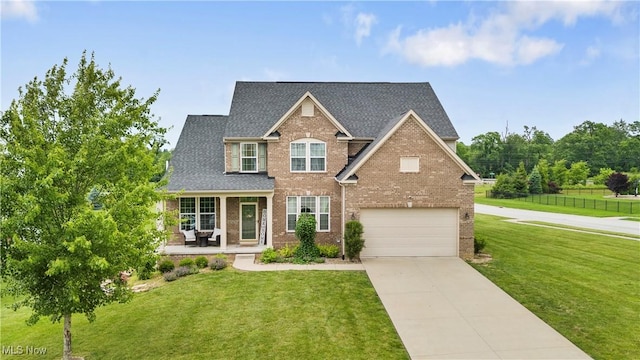 2979 Cloverhurst St NE, Canton, OH 44721 - view of front of house featuring brick siding, covered porch, an attached garage, driveway, and roof with shingles