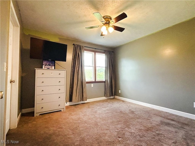 3585 Hayfield Rd, Dresden, OH 43821 - unfurnished bedroom with carpet, a textured ceiling, and a ceiling fan