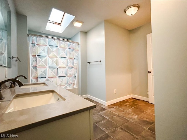 3585 Hayfield Rd, Dresden, OH 43821 - full bathroom featuring a skylight and vanity