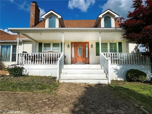 3585 Hayfield Rd, Dresden, OH 43821 - view of front of property featuring a porch, a chimney, and roof with shingles