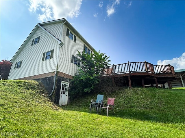 3585 Hayfield Rd, Dresden, OH 43821 - back of house with a deck and a lawn
