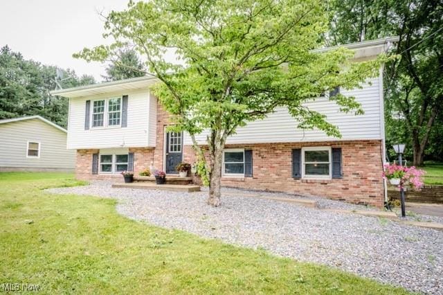 503 W Pidgeon Rd, Salem, OH 44460 - rear view of house with brick siding and a lawn