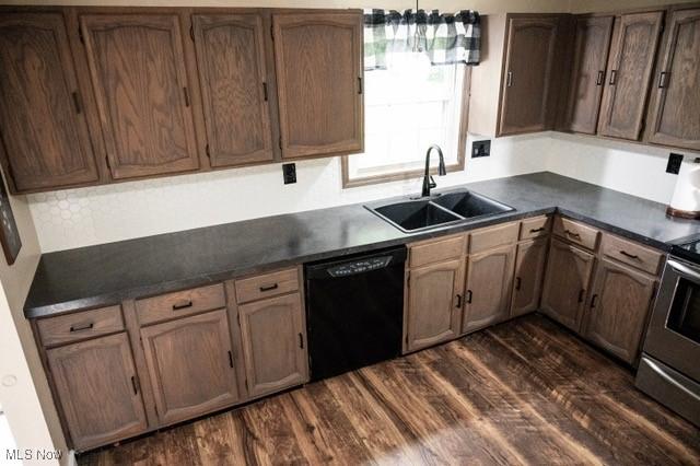 503 W Pidgeon Rd, Salem, OH 44460 - kitchen featuring black dishwasher, dark countertops, dark wood-style flooring, and stainless steel range oven