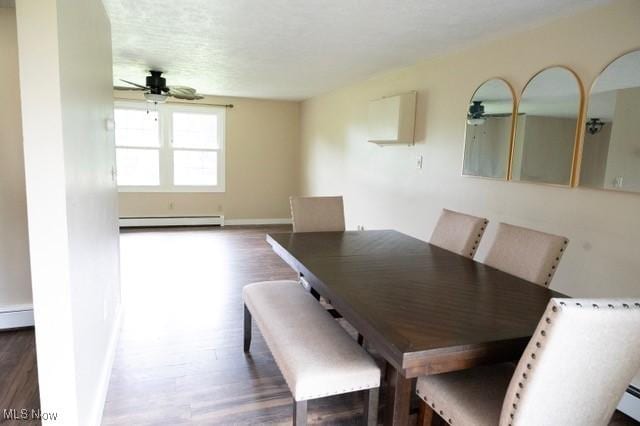 503 W Pidgeon Rd, Salem, OH 44460 - dining space with a baseboard heating unit, a ceiling fan, and wood finished floors