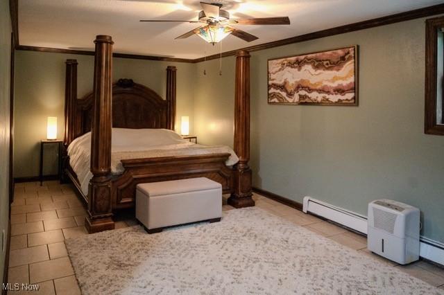 503 W Pidgeon Rd, Salem, OH 44460 - bedroom with a baseboard heating unit, ornamental molding, tile patterned flooring, and ceiling fan