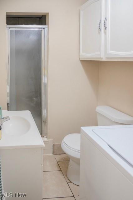 503 W Pidgeon Rd, Salem, OH 44460 - bathroom with vanity, washer / dryer, a stall shower, and tile patterned floors