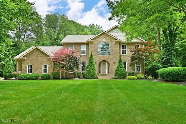 2878 Beaver Trl, Cortland, OH 44410 - view of front of house featuring a front lawn and brick siding